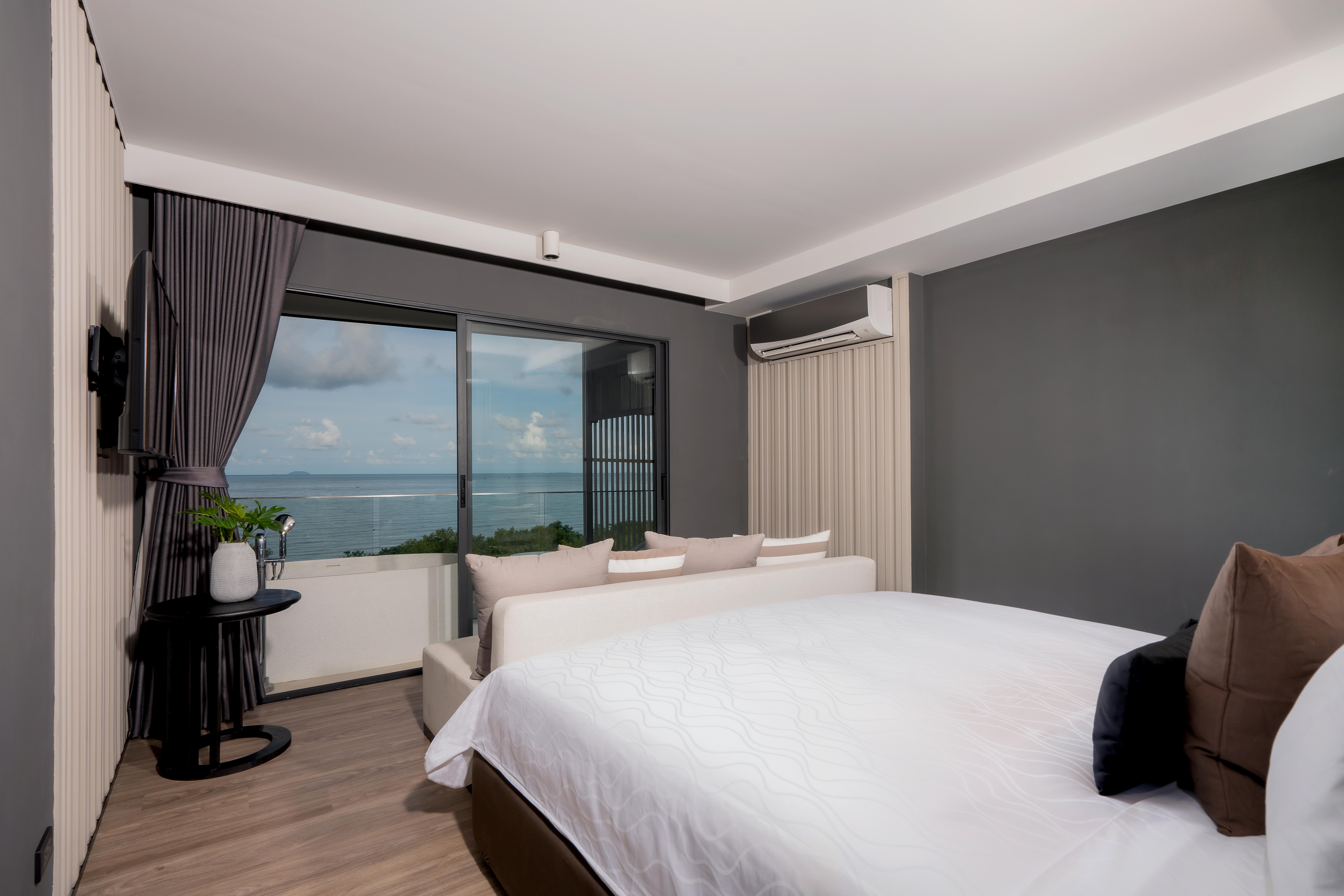 Bayphere Hotel Pattaya Jc Na Chom Thian Bagian luar foto A bedroom in a hotel